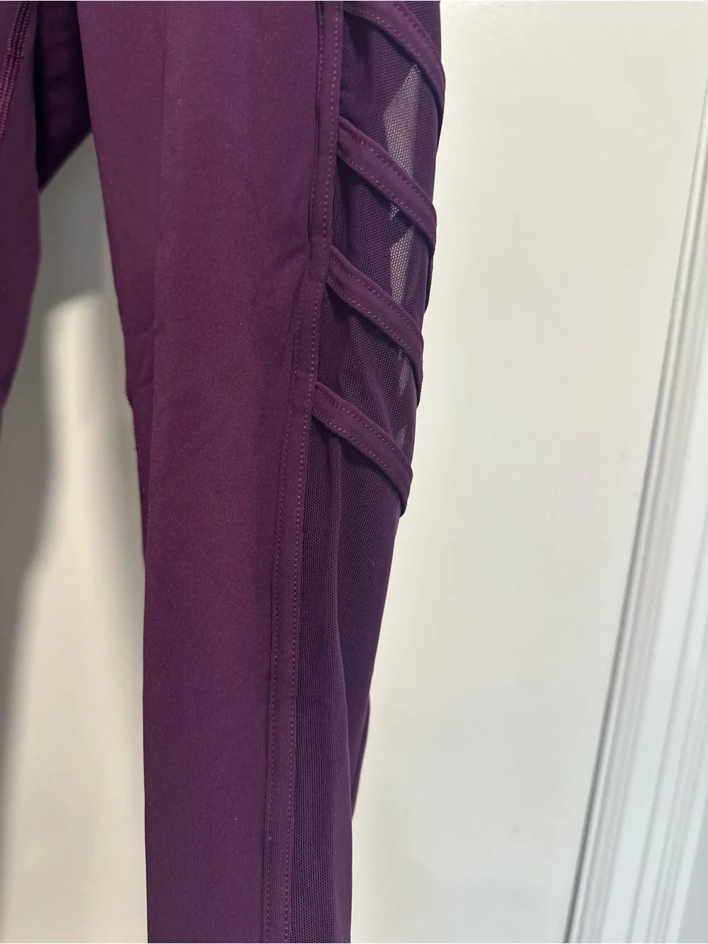 Lululemon Wild and Free purple leggings mesh sides/ pockets strappy detailing.